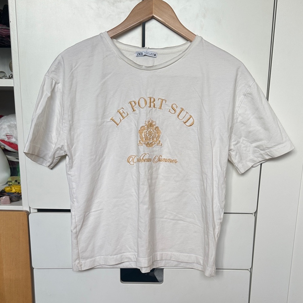 Zara Cream Tee with Gold Crest Graphic